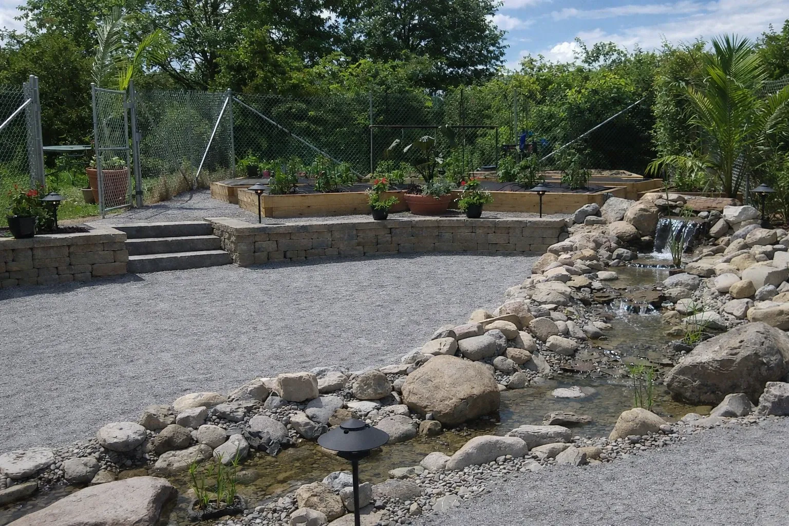 Pondless waterfall feature surrounded by natural stone